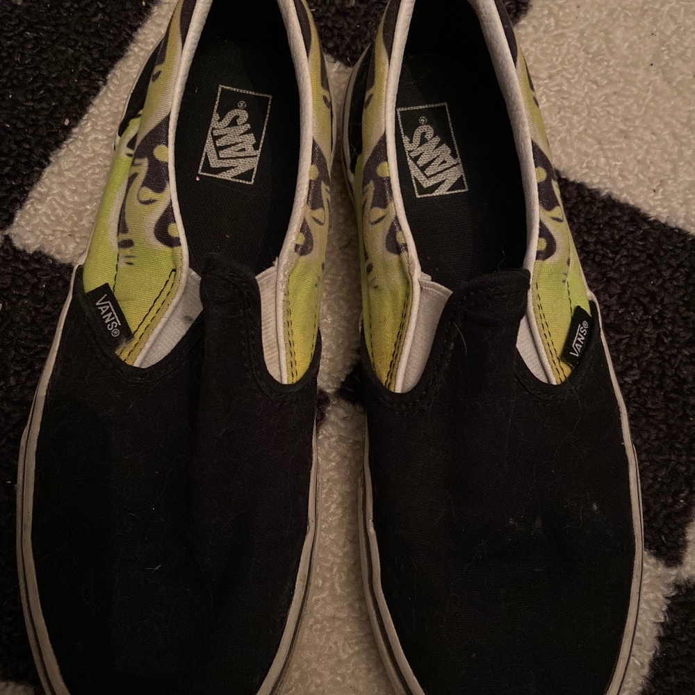 Yellow-green drip black vans off the wall